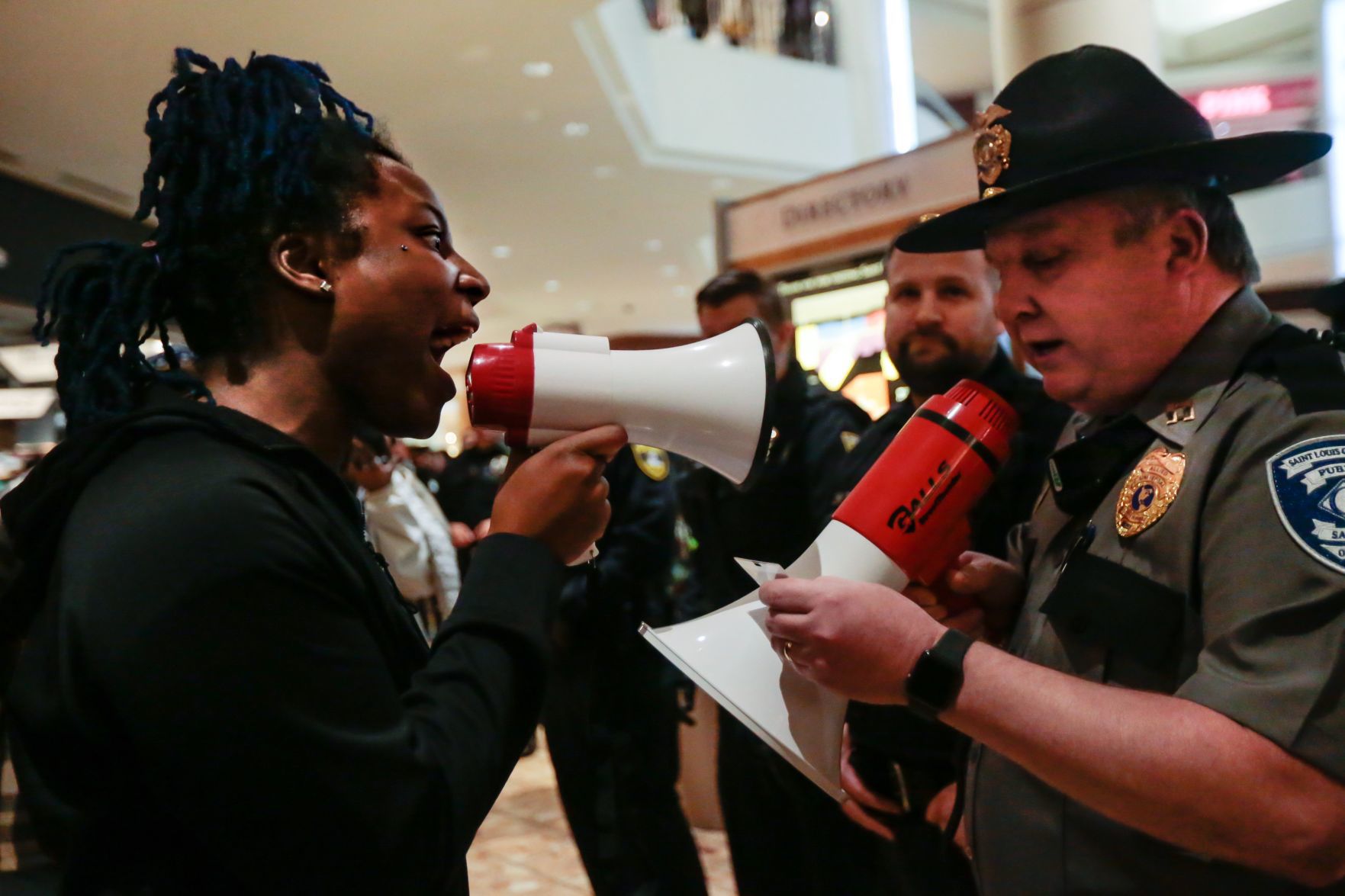 Protesters march in the St. Louis Galleria on Black Friday